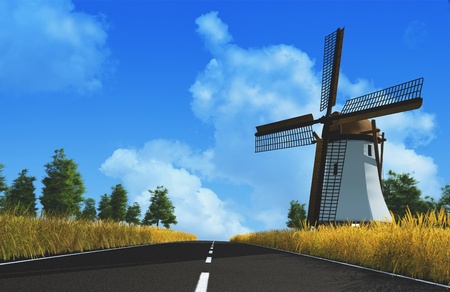 The road and the mill on a background of blue sky.の写真素材