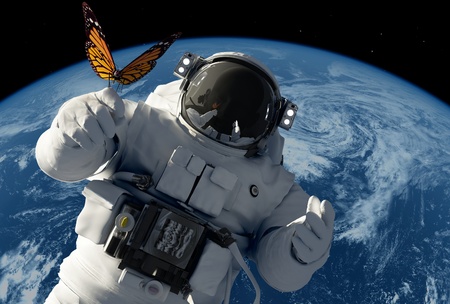 Astronaut with a butterfly on the background of the planet.の写真素材