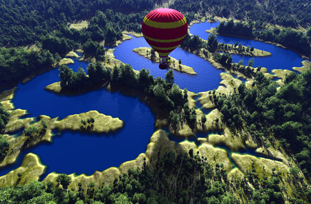 Balloon on a background of green landscape.の写真素材