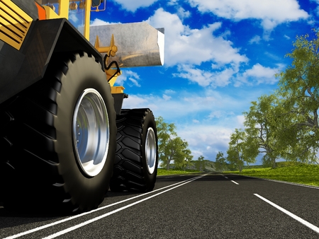 Tractor on the road outside the city.の写真素材