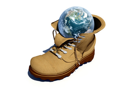 Globe in a shoe on a white background.の写真素材