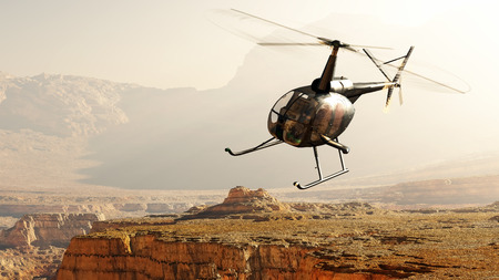 Civilian helicopter over the mountains.の写真素材