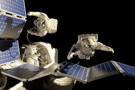 Astronauts in space around the solar battarei.の写真素材