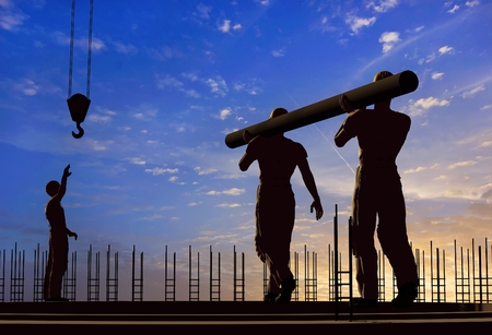 Two workers carry a pipe.3d renderの写真素材
