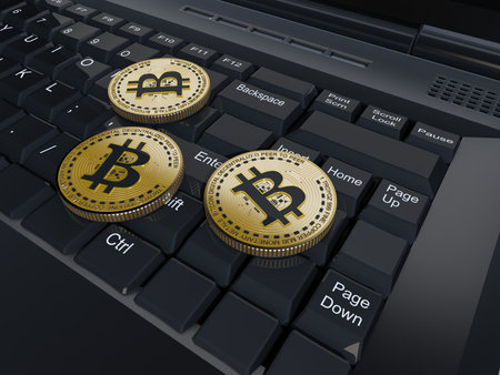 Bitcoin coins on a laptop.,3d renderの写真素材