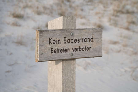 Sign, bathing prohibited, trespassing prohibited, in the national park, on the Darss. Dangerous dunes and cliffs on the Baltic Sea. Animal protectionの写真素材