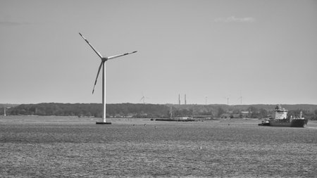 Offshore wind turbine in the sea, on the coast in black and white. Green energy of the future. Renewable energy supply. In the fight against climate change. Green electricityの写真素材