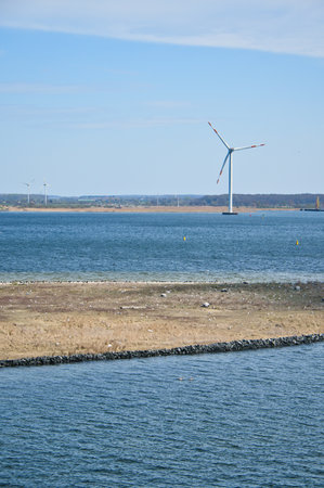 Offshore wind turbine in the sea, on the coast. Green energy of the future. Renewable energy supply. In the fight against climate change. Green electricityの写真素材