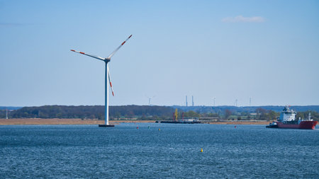 Offshore wind turbine in the sea, on the coast. Green energy of the future. Renewable energy supply. In the fight against climate change. Green electricityの写真素材