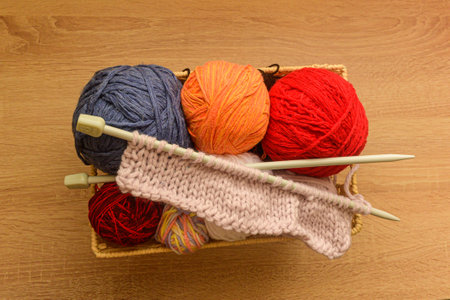 Many threads in basket with needles