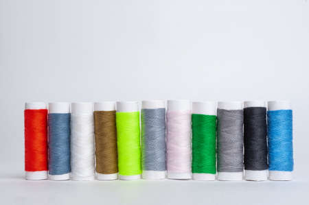 Colourful thread spools isolated on a white. High quality photo