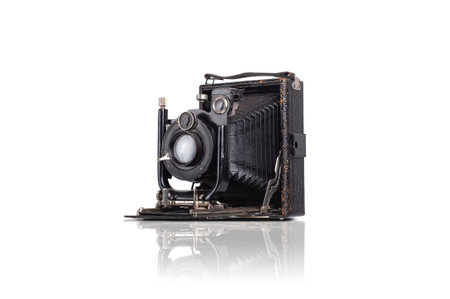 old black film photo camera isolated on white background