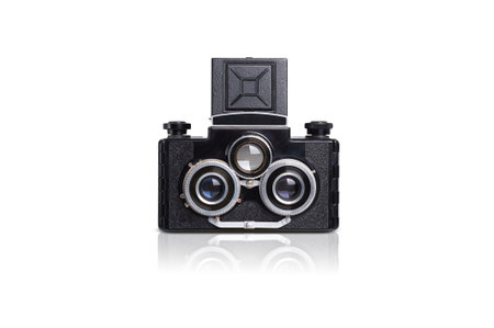 vintage black camera with three lenses on white background, stereo camera
