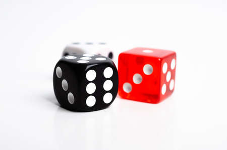 dice of black red and white colors isolated on white.の写真素材