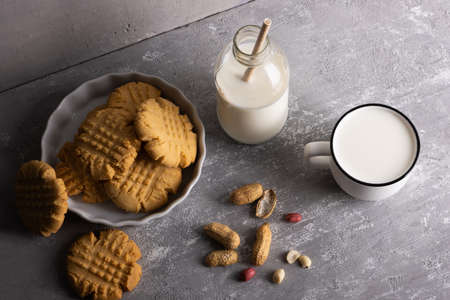 Linzer cookies served on a plate decorated with spruce branchesの写真素材