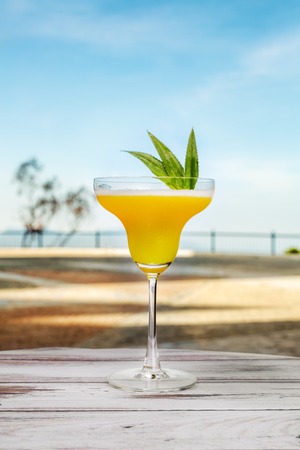 pineapple juice glass on table outdoor fresh