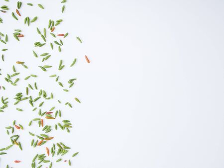 Fresh green and red hot chilli on white background, spicy Thai food. Top view, frame.の写真素材