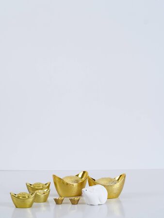 Chinese New Year 2020 decorations, dolls of mouse, chinese gold ingot (English translation for foreign text means blessing, luck and wealthy). Happy Year of the ratの写真素材