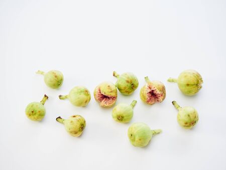 Many fresh figs and leaves on white background. Fruit for health. close upの写真素材