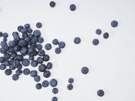 Blueberry frame on white background. Healthy food design. Top view, space for textの写真素材
