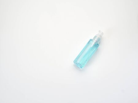 Bottle alcohol liquid isolated on white background. Prevent infection of Covid-19 virus.の写真素材