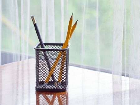 Pens and pencils on the desk at home. Space for text