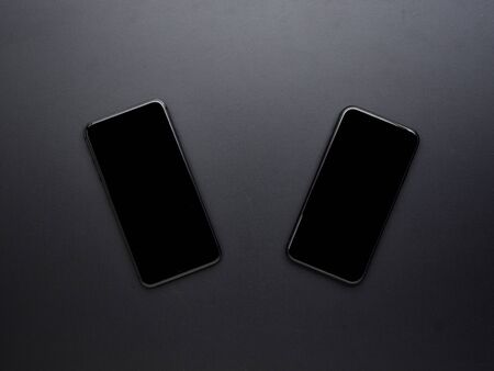 Close-Up of smartphone with blank black touch screen. Top view, space for text.の写真素材