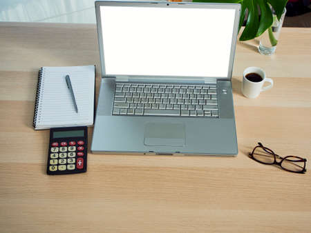 Home office workspace mockup with laptop on table at home