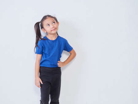 Portrait of little girl on light background. Space for textの写真素材