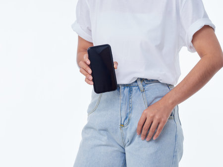 Woman showing smartphone on white background, closeup. Space for text