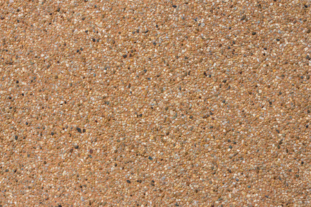 surface of orange gravel wall for the background の写真素材
