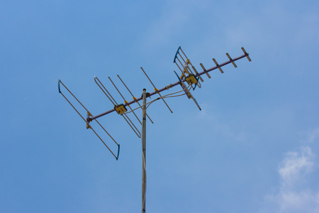 Classic Antenna like analog for TV on blue skyの写真素材