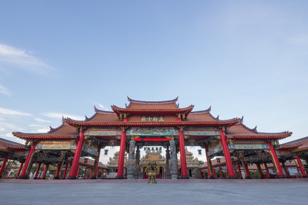 Red gateway of chinese temple, with blue skyの写真素材