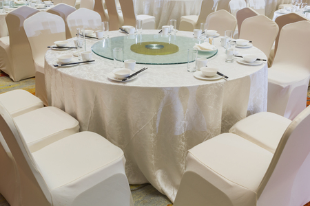 Round table from wedding party with Chinese dishes styleの写真素材