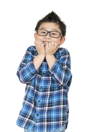 Back to school. Little child in glasses feels like shock when time to school on white  on isolatedの写真素材