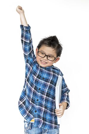 Back to school. Cute boy in glasses having cheerful when time to school on white  on isolatedの写真素材