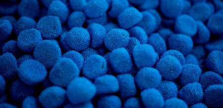 blue marmalade in the form of blackberries in a pile. lots of blue marmalade background texture...