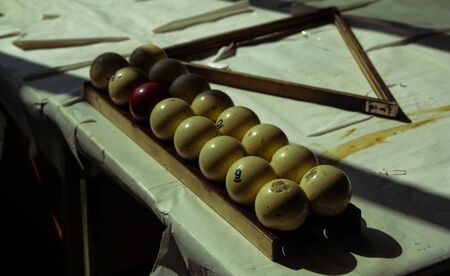 antique billiard balls in the old room and on the old table covered with white paper. inscription: no smokingの写真素材