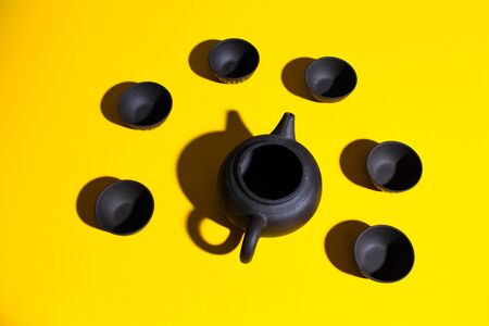clay teapots bowls on a colored background. Chinese tea party tableware seamless Wallpaper background screensaverの写真素材