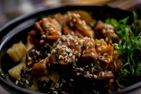 chicken poke with seaweed. chicken dish with sesame rice and seaweed.