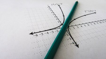Graphical representation of math functions and a pencilの写真素材