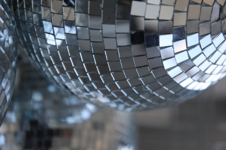 disco balls lying in the basket on top of each other disco balls behind the bars balls from the mirrorの写真素材