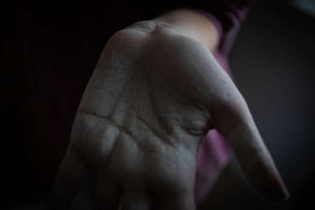 beautiful women's hands smeared in white paint after working with their hands. home renovation. painting works. hands covered in paint. whitewashing the textureの写真素材