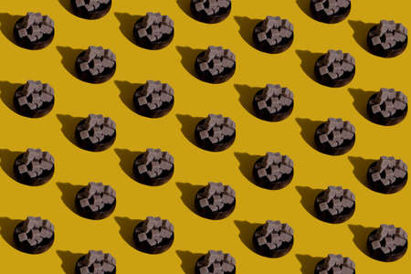 pattern made of brown sugar wallpaper for your screen. screen saver for advertising background texture. circle of sugar cubes pyramid of sugar sugar cubesの写真素材