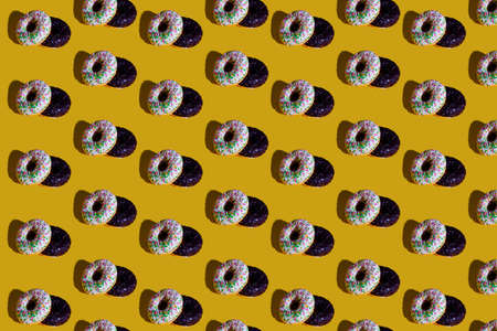 a pattern of white and black donuts. food pattern background texture splash screenの写真素材