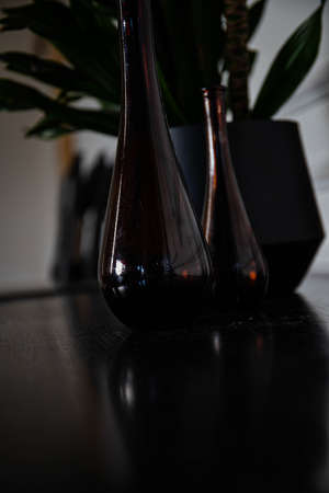 Vintage wooden chest of drawers close-up indoors with flowers and brown wallの写真素材