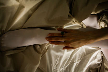women's feet in white stockings white socks on the bed style background screensaver picture decor...