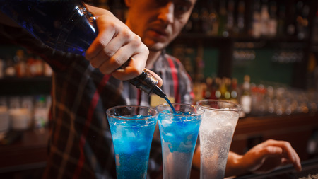 preparation of alcoholic beverages at the barの写真素材