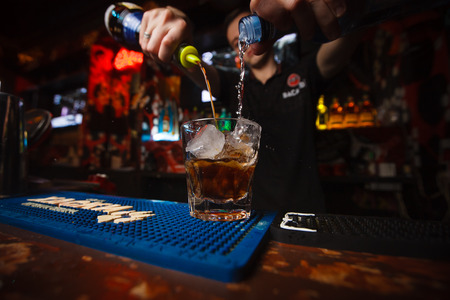 The bartender pours a cocktail White Russianのeditorial素材