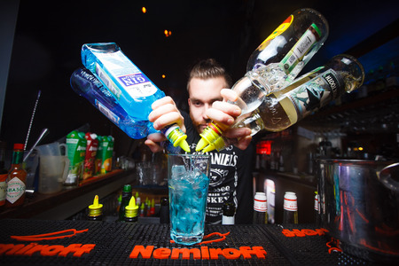 MOSCOW, RUSSIA - NOVEMBER 10, 2016: The bartender prepares alcoholic cocktail on the bar Nemiroffのeditorial素材